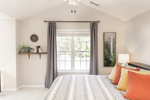 a bathroom with a bathtub a sink and a window
