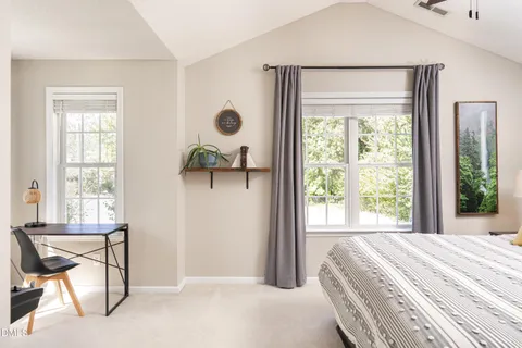 a bathroom with a double vanity sink and mirror with bathtub
