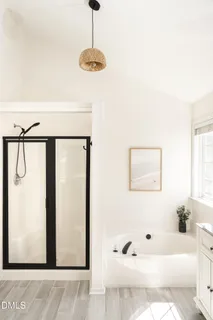 a view of house with a yard and sitting area