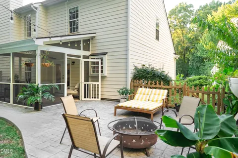 a view of balcony with wooden floor and fence
