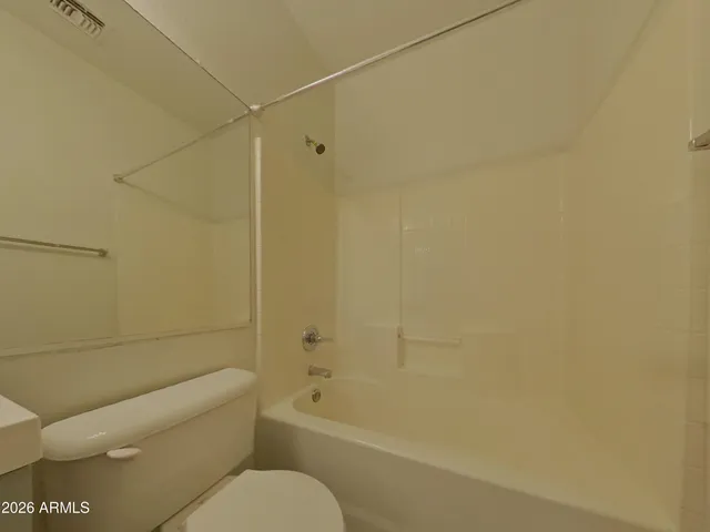 a bathroom with a toilet and a bathtub