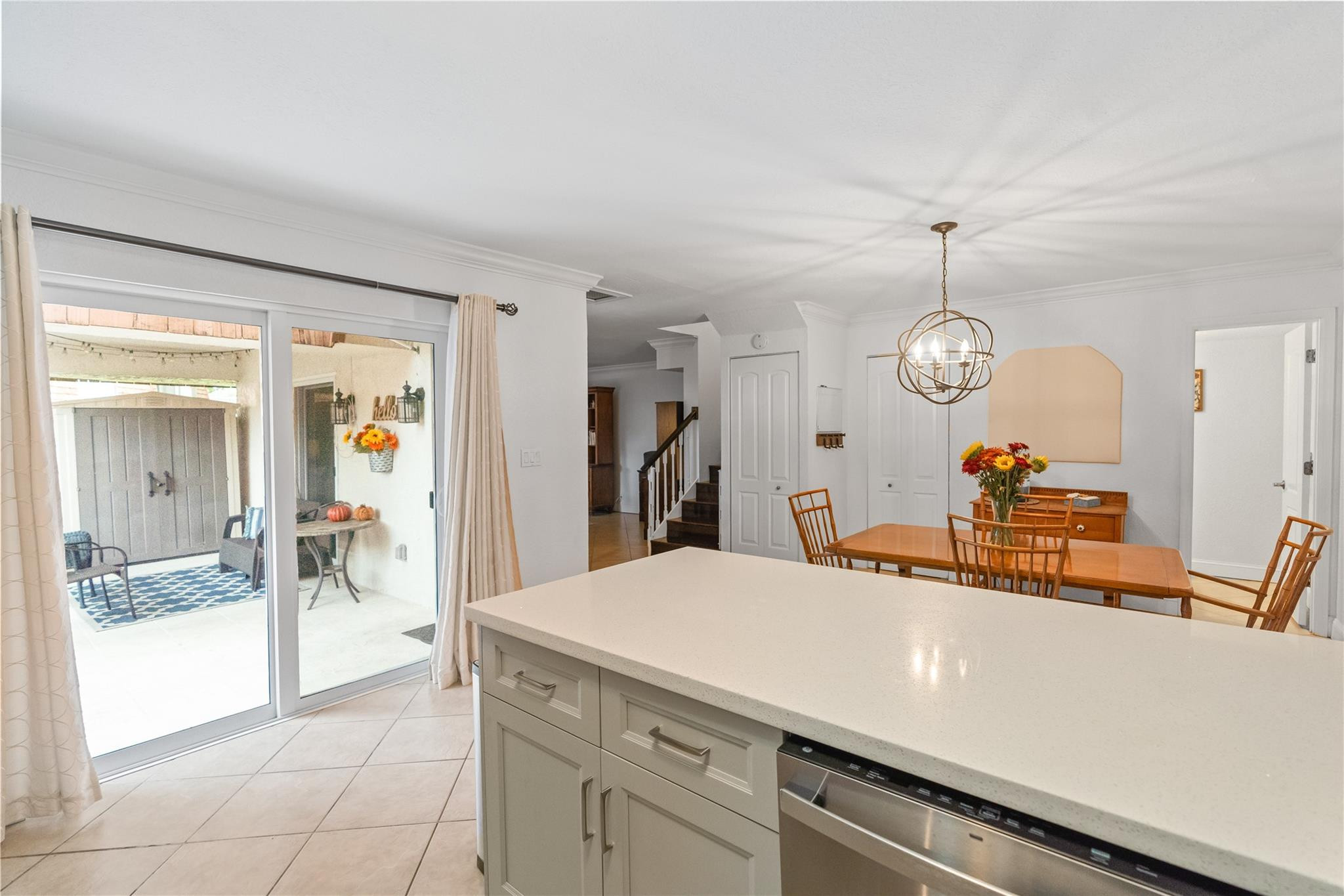 2061 Southwest 90th Avenue, Unit B17 Davie, FL 33324 - Photo 14 of 38 a very nice looking room with a large window and chandelier