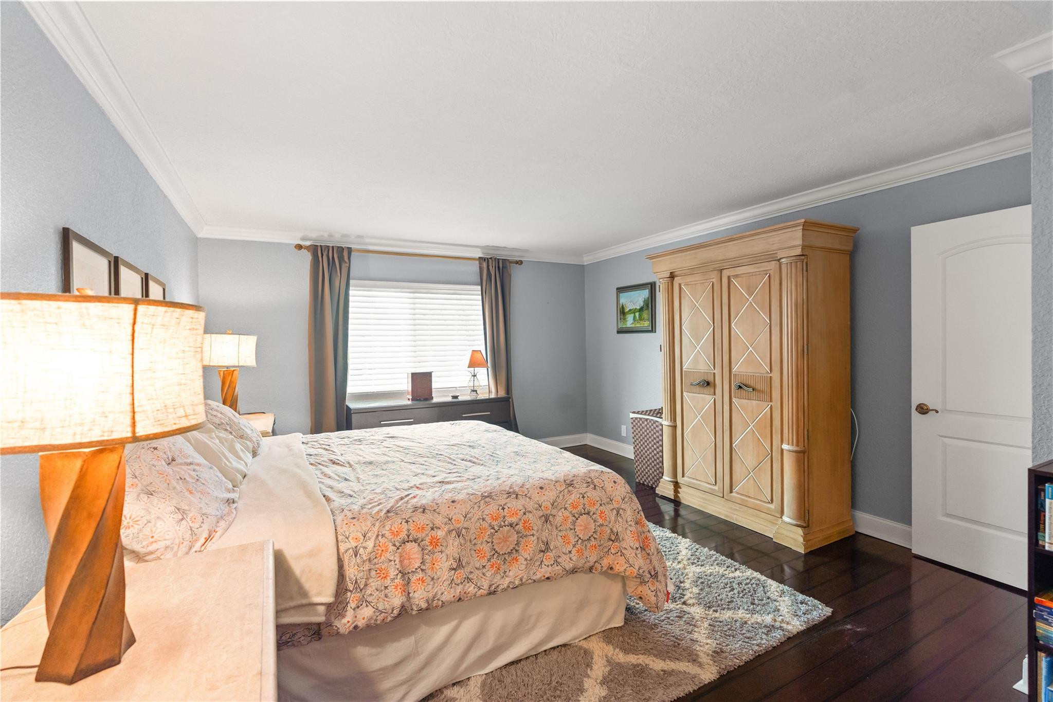 2061 Southwest 90th Avenue, Unit B17 Davie, FL 33324 - Photo 22 of 38 a bedroom with a bed and wooden floor