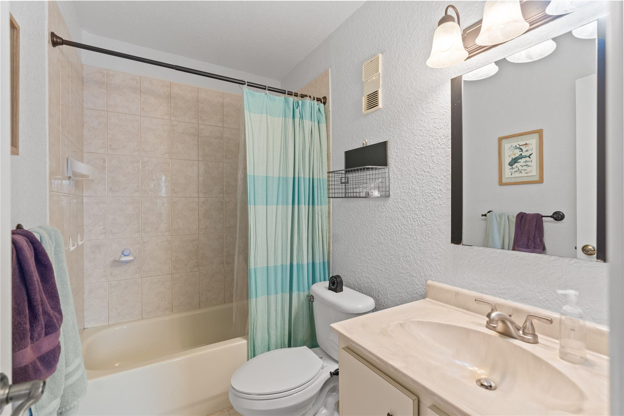 2061 Southwest 90th Avenue, Unit B17 Davie, FL 33324 - Photo 26 of 38 a bathroom with a sink a toilet a mirror and shower