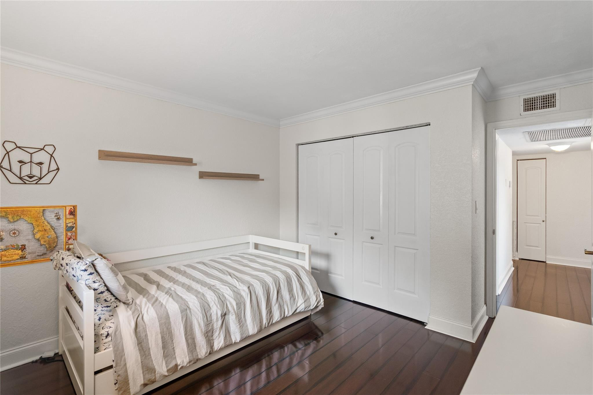 2061 Southwest 90th Avenue, Unit B17 Davie, FL 33324 - Photo 31 of 38 a bedroom with a bed and painting on the wall