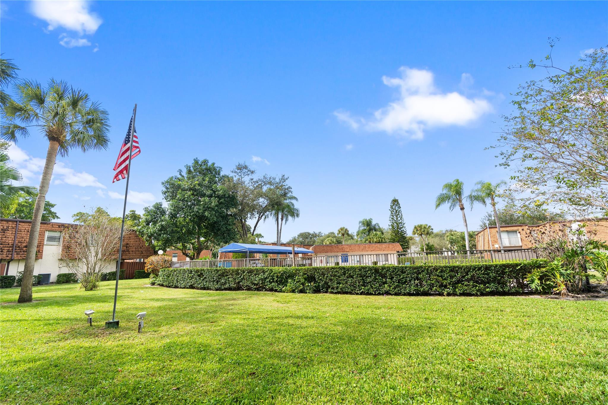 2061 Southwest 90th Avenue, Unit B17 Davie, FL 33324 - Photo 32 of 38 a view of a fountain in front of a house