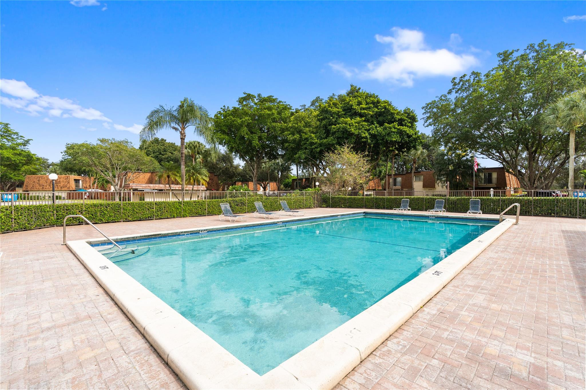 2061 Southwest 90th Avenue, Unit B17 Davie, FL 33324 - Photo 34 of 38 swimming pool with outdoor seating and garden