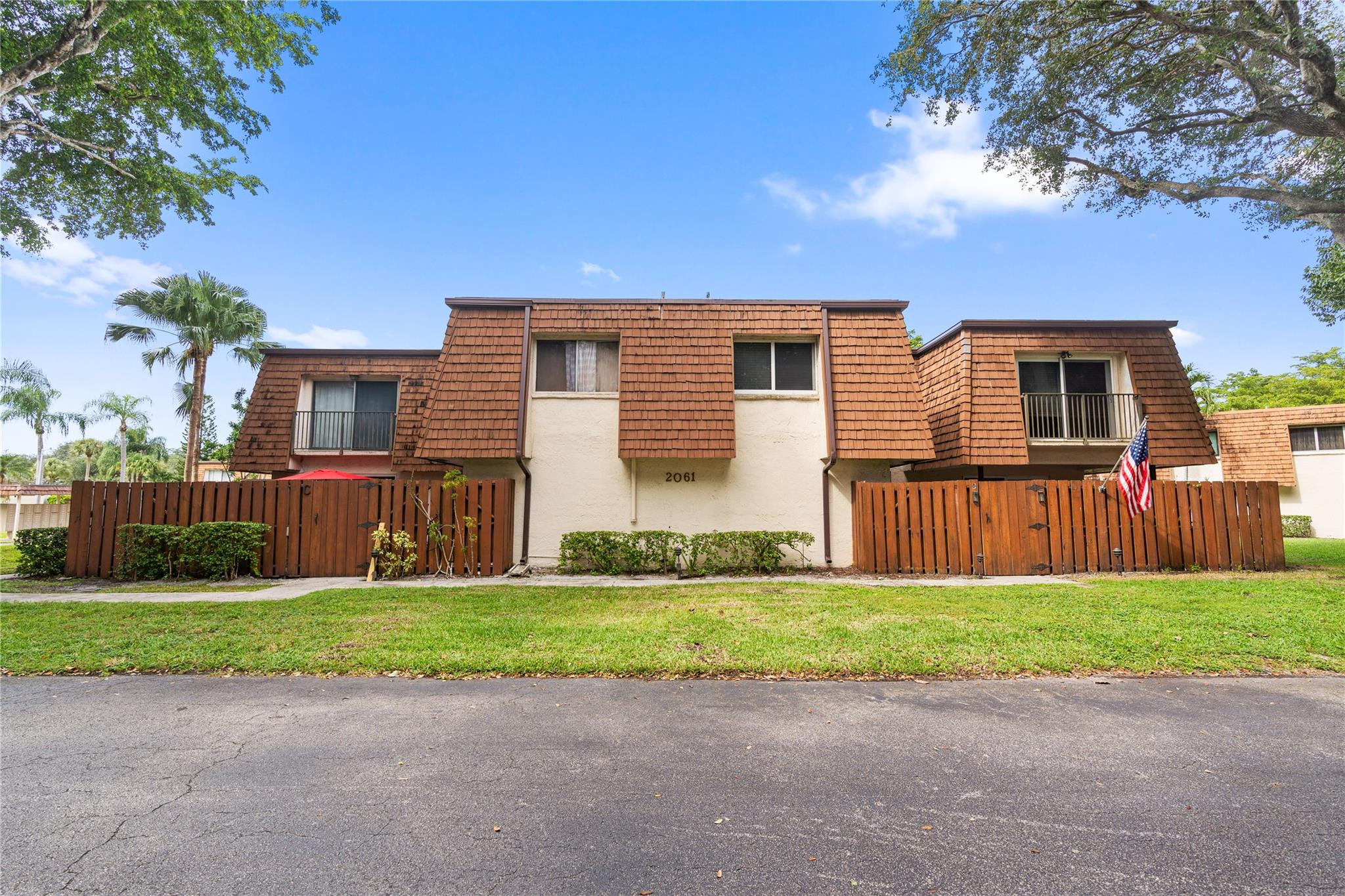 2061 Southwest 90th Avenue, Unit B17 Davie, FL 33324 - Photo 36 of 38 a view of a house with a yard and large trees