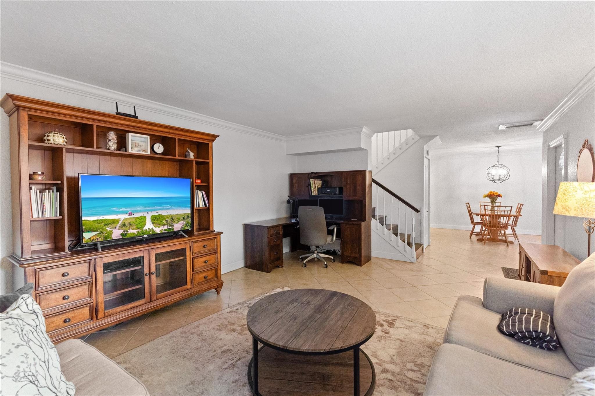 2061 Southwest 90th Avenue, Unit B17 Davie, FL 33324 - Photo 8 of 38 a living room with furniture and a flat screen tv