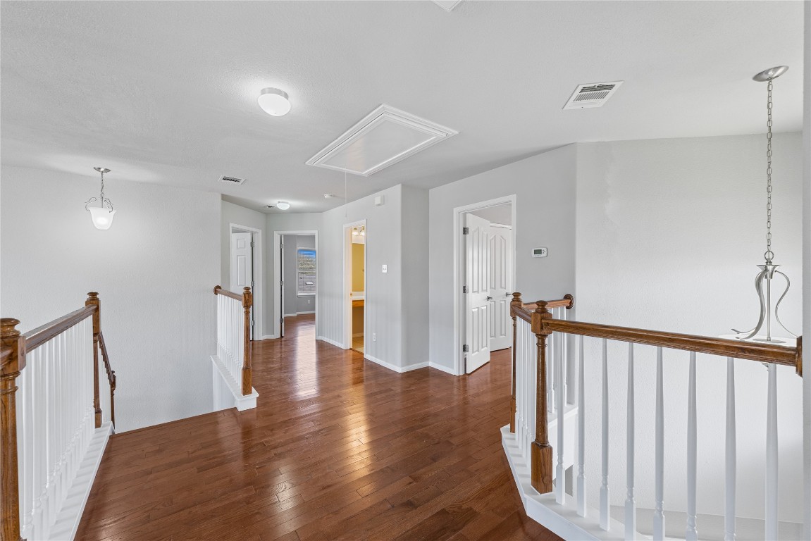 12017 Lansdowne Road Austin, TX 78754 - Photo 18 of 30 a view of a hallway with wooden floor