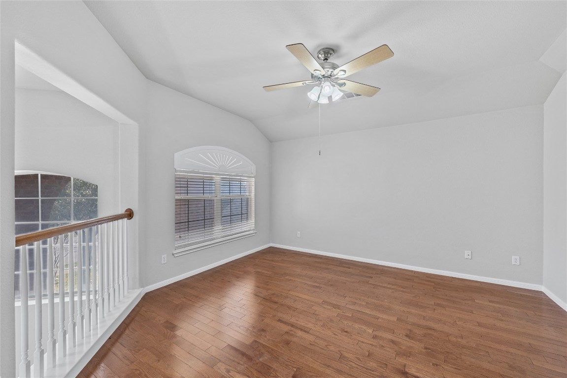 12017 Lansdowne Road Austin, TX 78754 - Photo 19 of 30 a view of an empty room with wooden floor and a window
