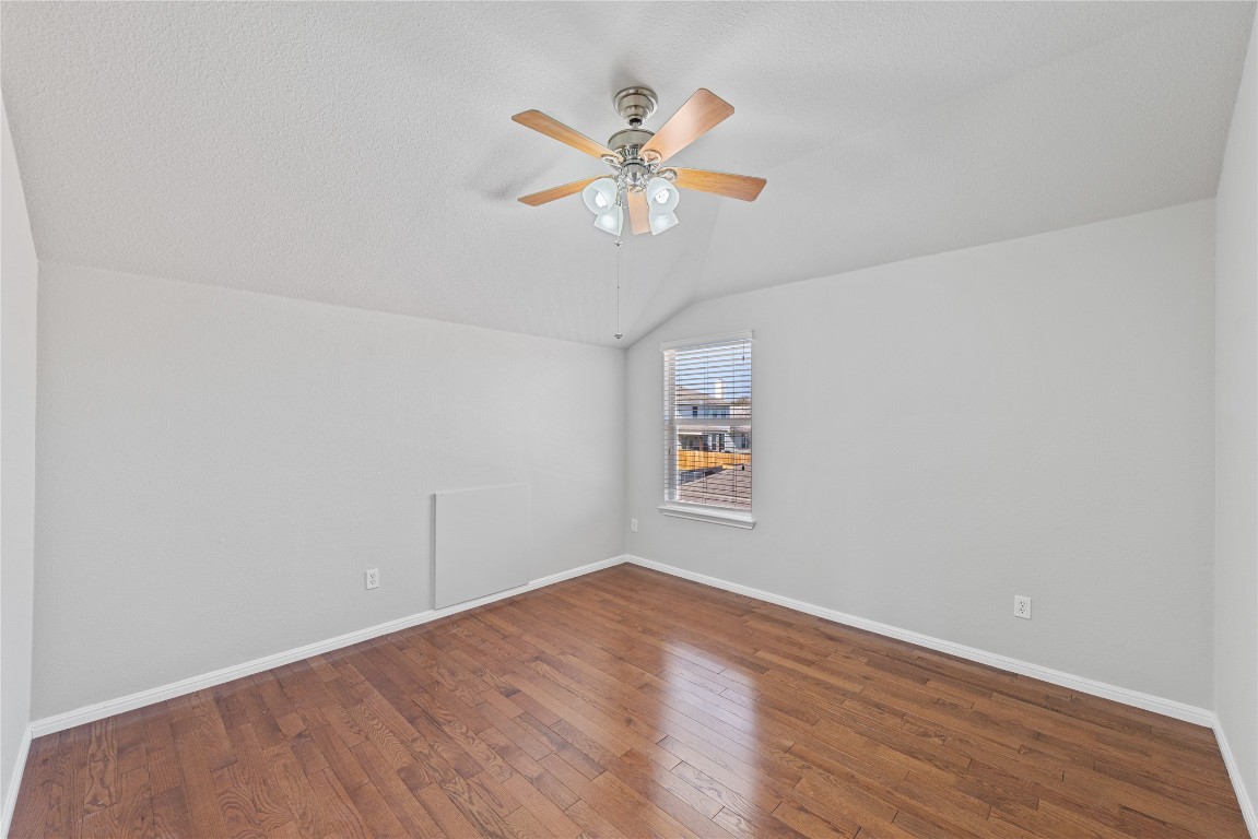 12017 Lansdowne Road Austin, TX 78754 - Photo 23 of 30 an empty room with a window and a fan
