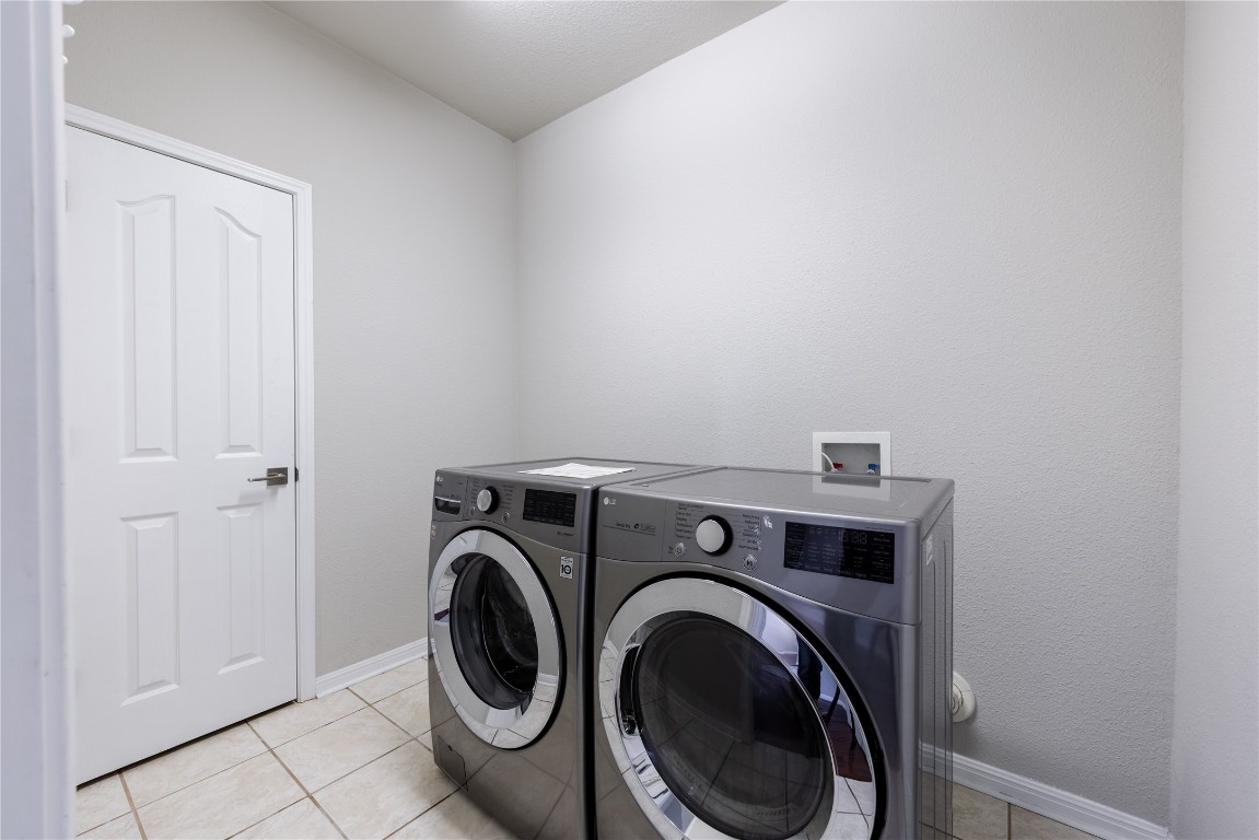 12017 Lansdowne Road Austin, TX 78754 - Photo 24 of 30 a utility room with dryer and washer