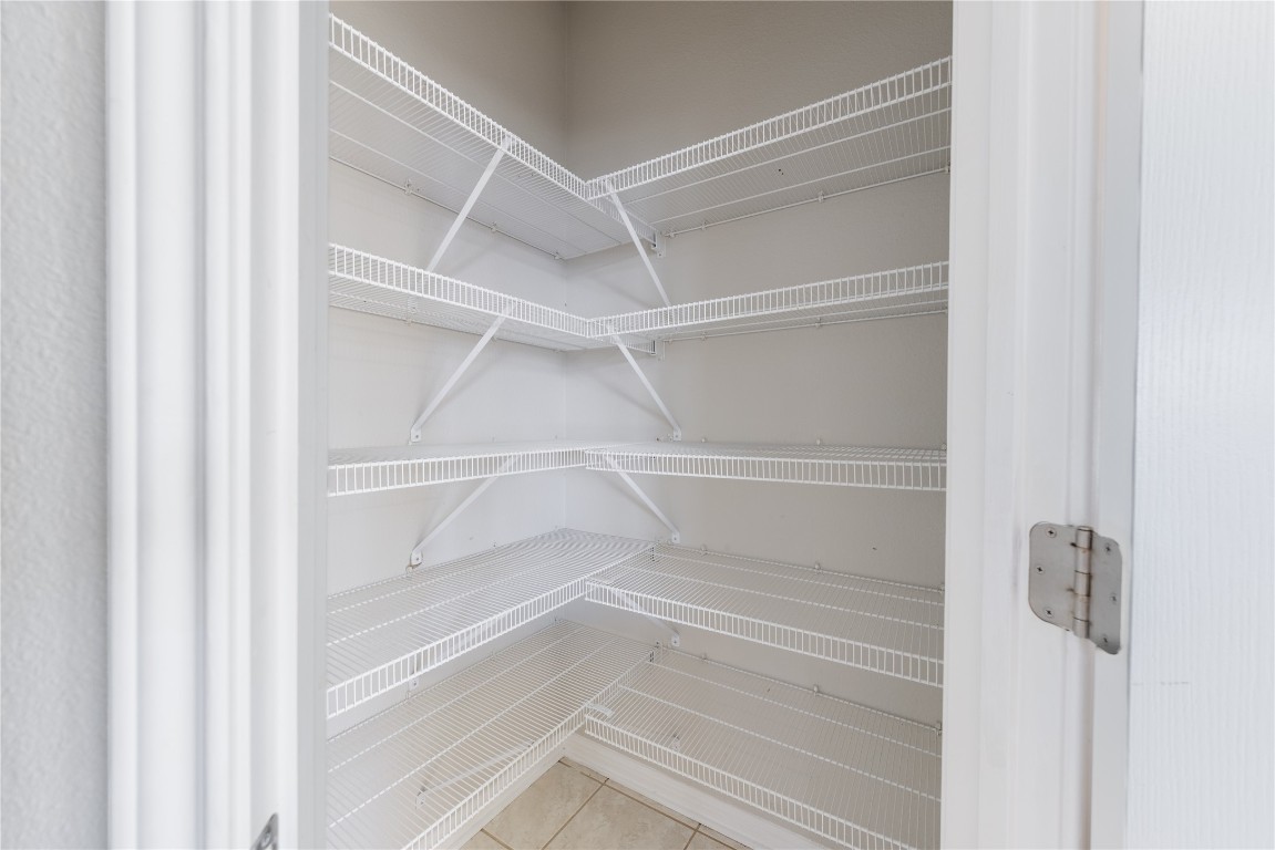 12017 Lansdowne Road Austin, TX 78754 - Photo 26 of 30 a view of walk in closet with empty racks