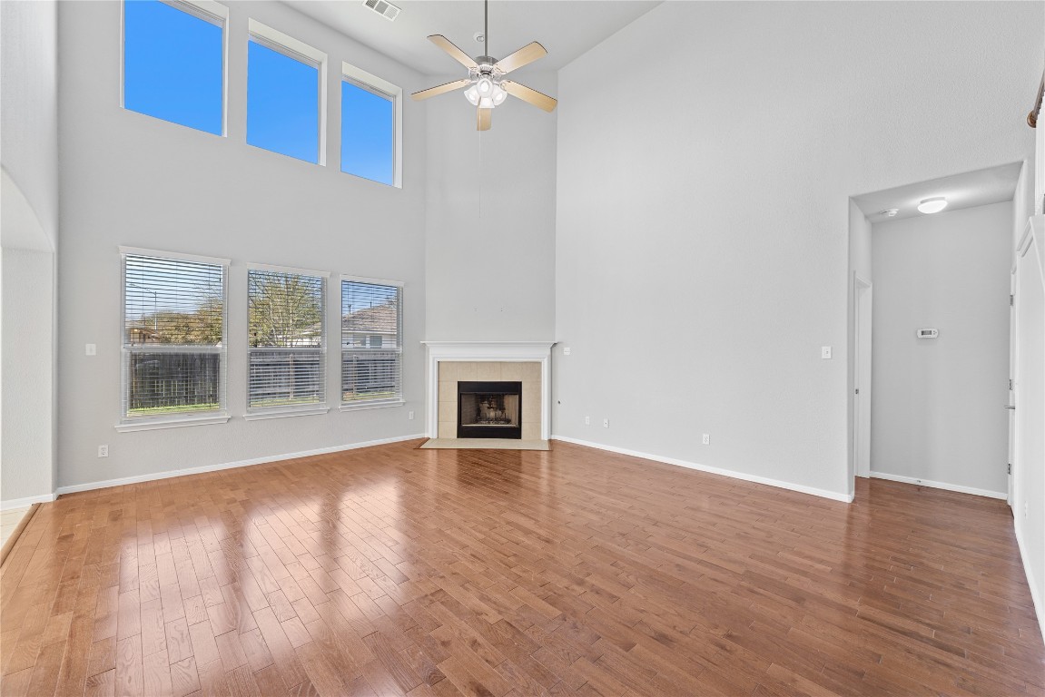 12017 Lansdowne Road Austin, TX 78754 - Photo 4 of 30 a view of an empty room with wooden floor and a window
