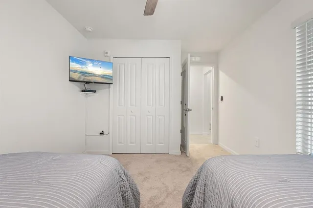 a bedroom with a bed and a mirror