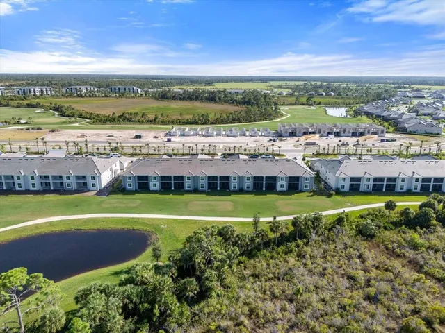 a view of a swimming pool with an outdoor space and seating area