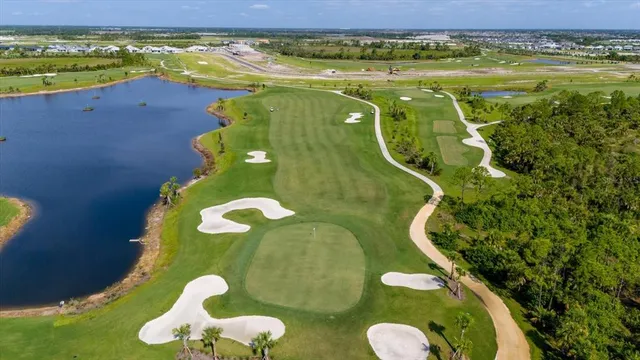 a view of a swimming pool with a yard