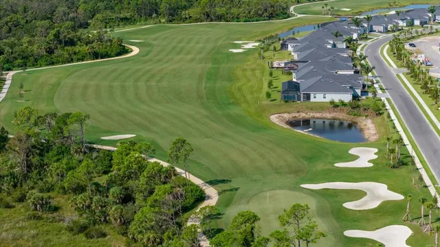an aerial view of a residential houses with outdoor space