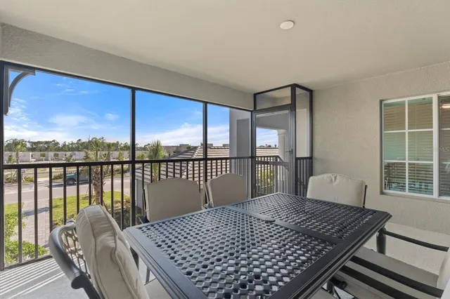 a bedroom with a bed and glass window