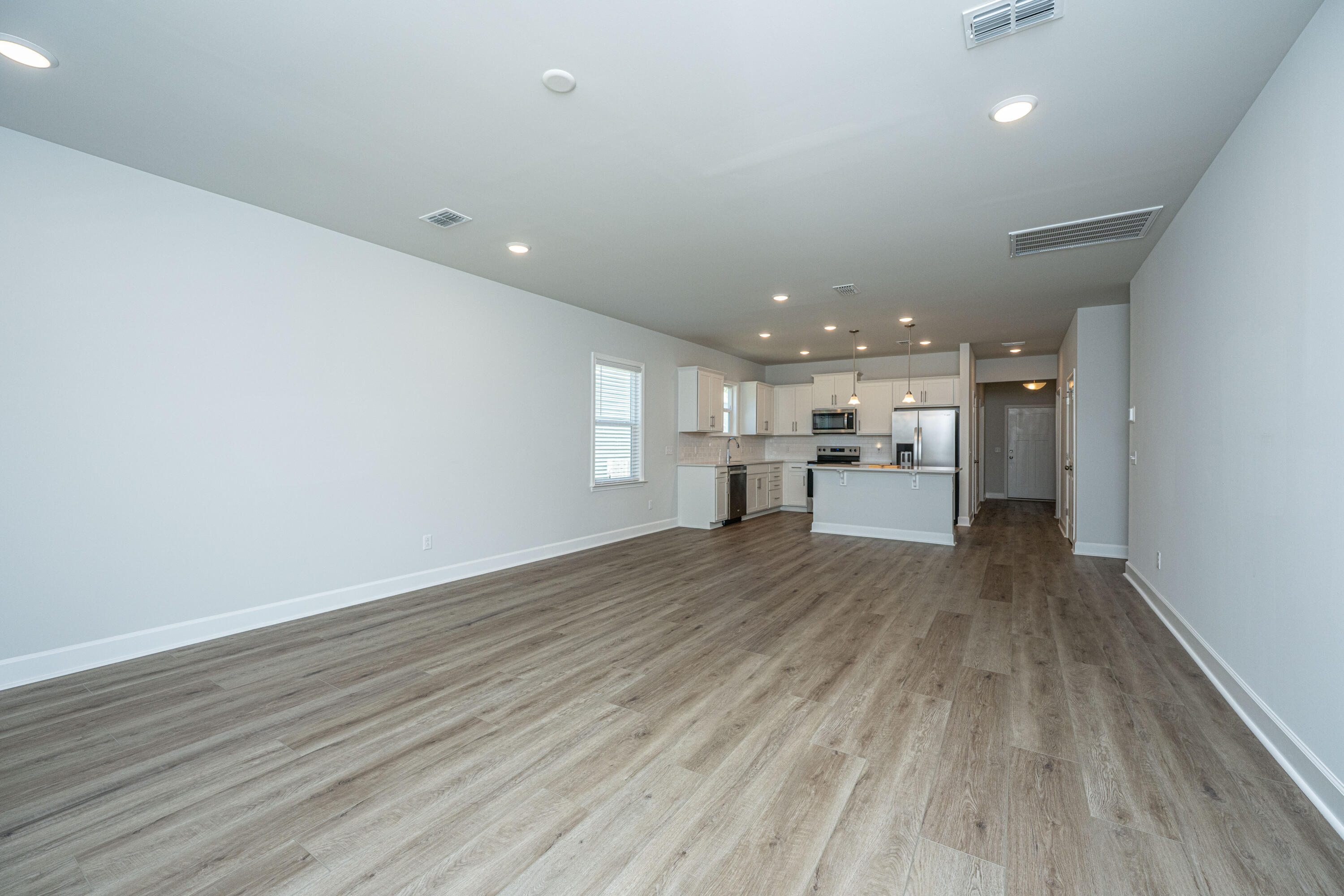 117 Royal Cainhoy Way Huger, SC 29450 - Photo 14 of 37 Living space view to kitchen