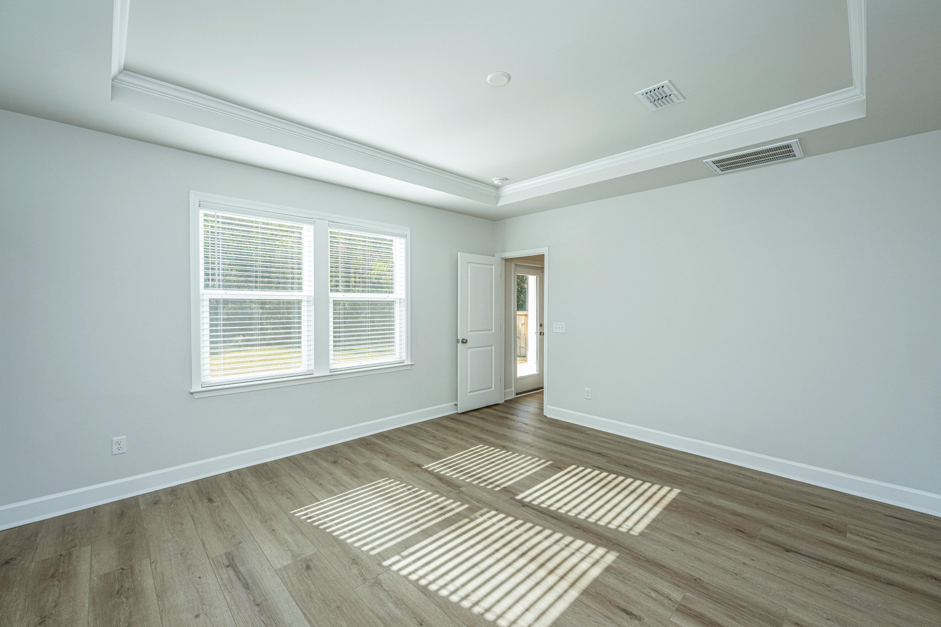 117 Royal Cainhoy Way Huger, SC 29450 - Photo 17 of 37 Primary bdrm view to rear door