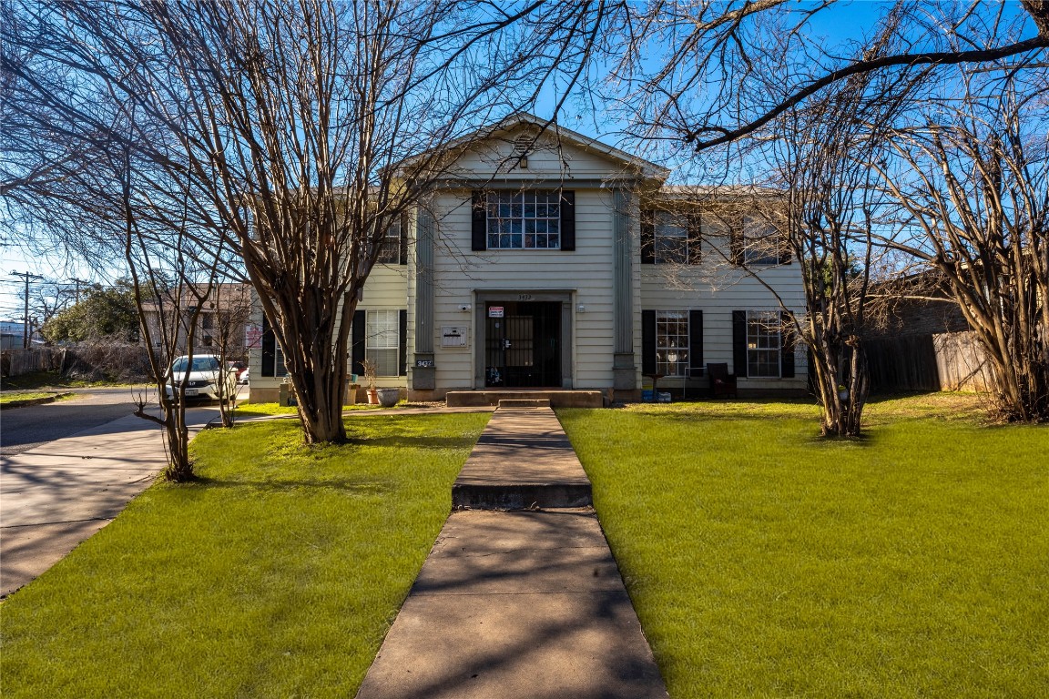 a front view of a building with garden