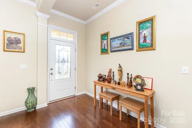 a view of a workspace with furniture and wooden floor