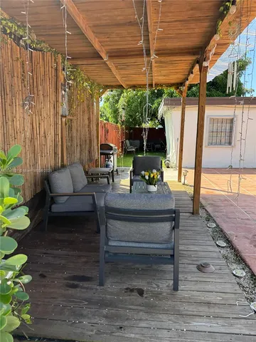 a outdoor living space with furniture and a garden