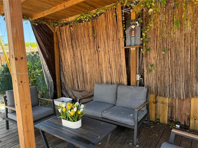 a view of patio with a table and chairs