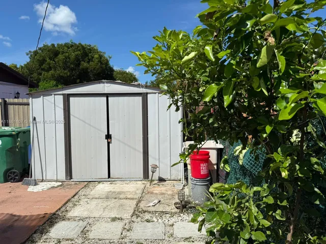 a backyard of a house with seating space