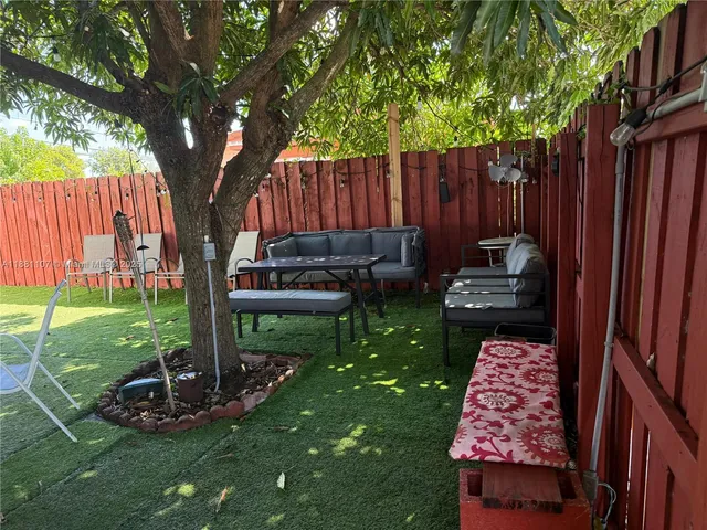 a view of a chairs in a backyard