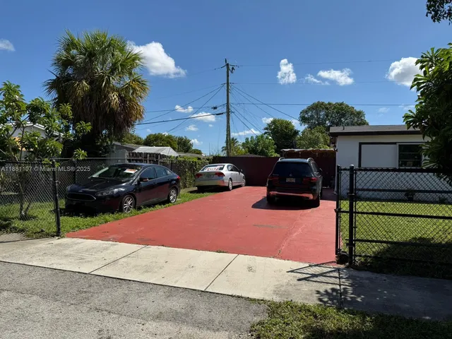 a park view with a bench in patio