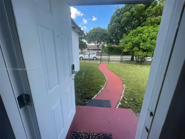a view of a yard from a balcony