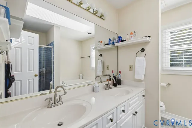 a bathroom with a sink vanity and a mirror