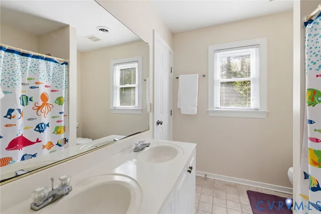 a living room with furniture and a piano