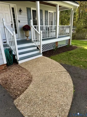 a view of a porch with a garden