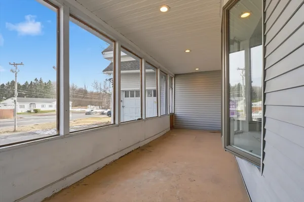 a view of a big room with windows
