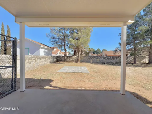 a view of a living room and kitchen