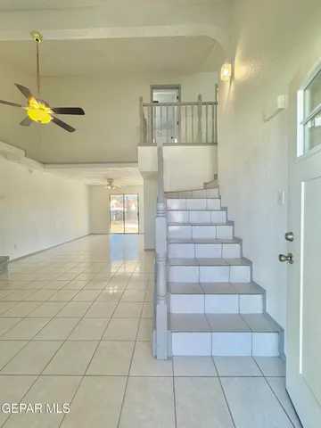 a view of a hallway with seating area