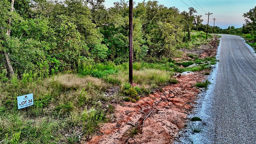 Lot 34 Red Oak Hills Road Nocona, TX 76255 - Photo 17 of 24 a picture of street view with tree