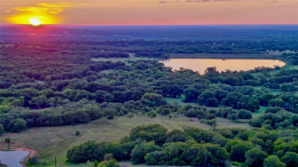 Lot 34 Red Oak Hills Road Nocona, TX 76255 - Photo 9 of 24 an aerial view of residential houses with outdoor space and trees