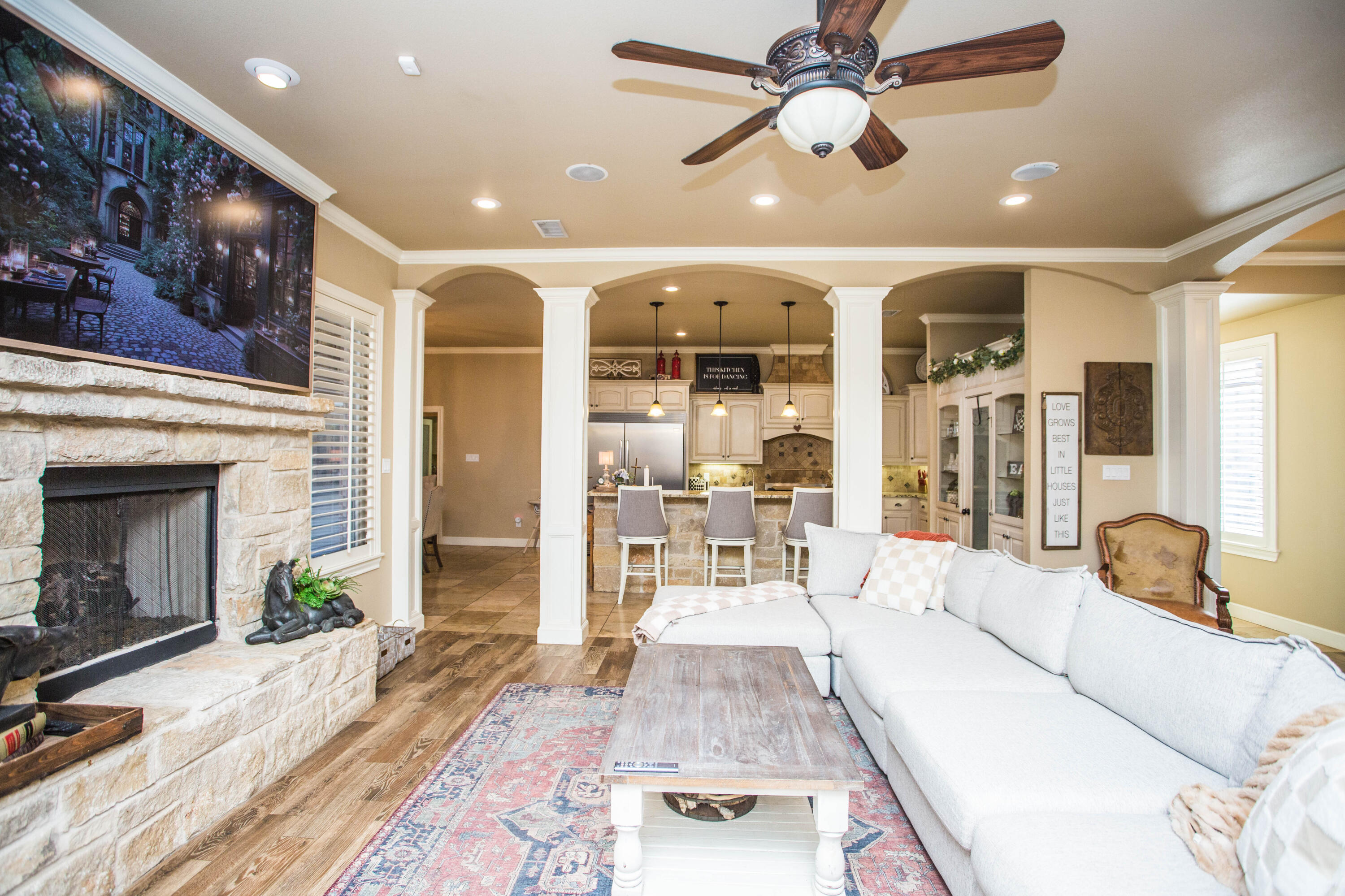 6018 87th Street Lubbock, TX 79424 - Photo 13 of 98 a living room with furniture and a fireplace
