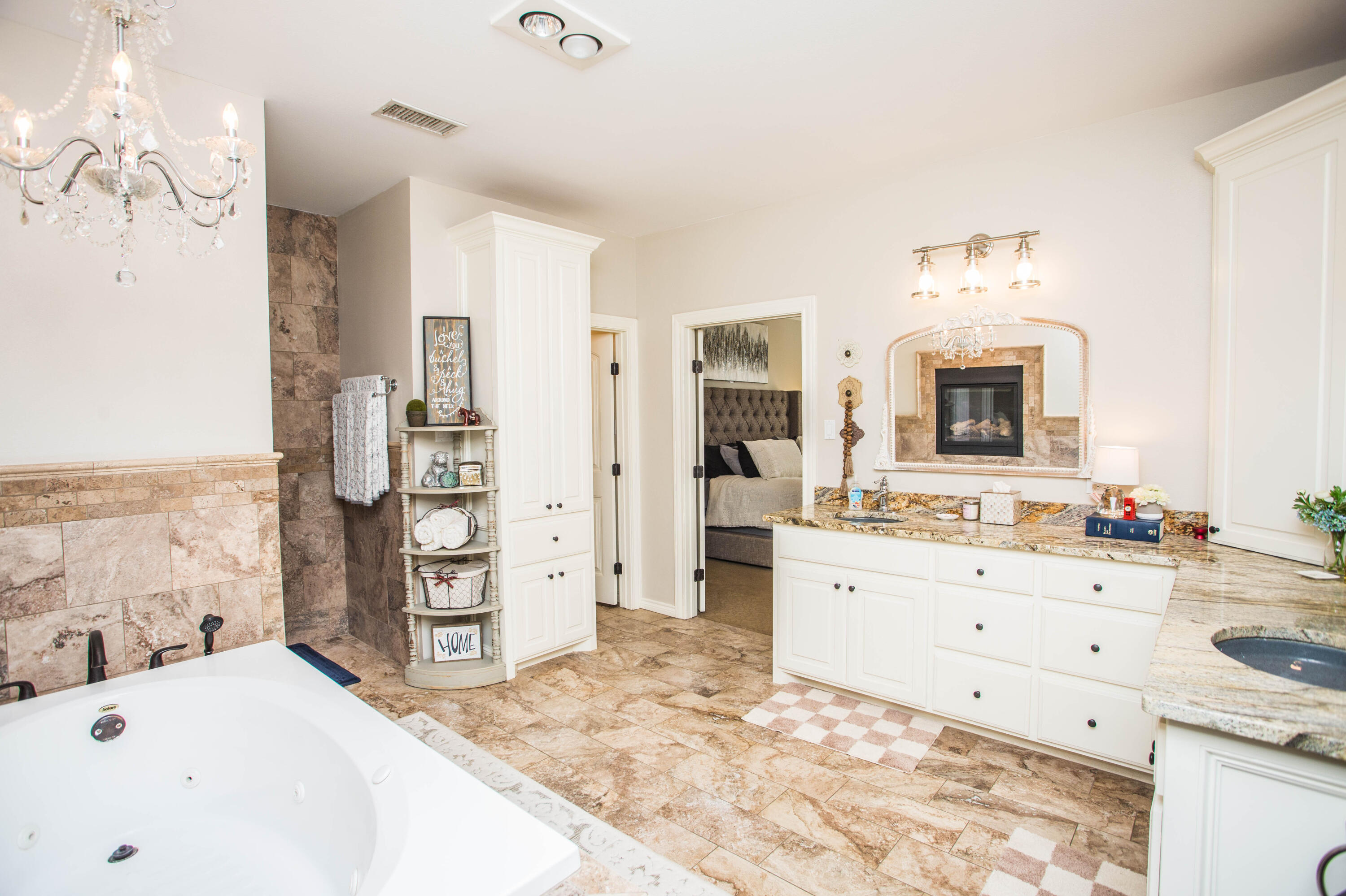 6018 87th Street Lubbock, TX 79424 - Photo 39 of 98 a large bedroom with a bed and a flat screen tv