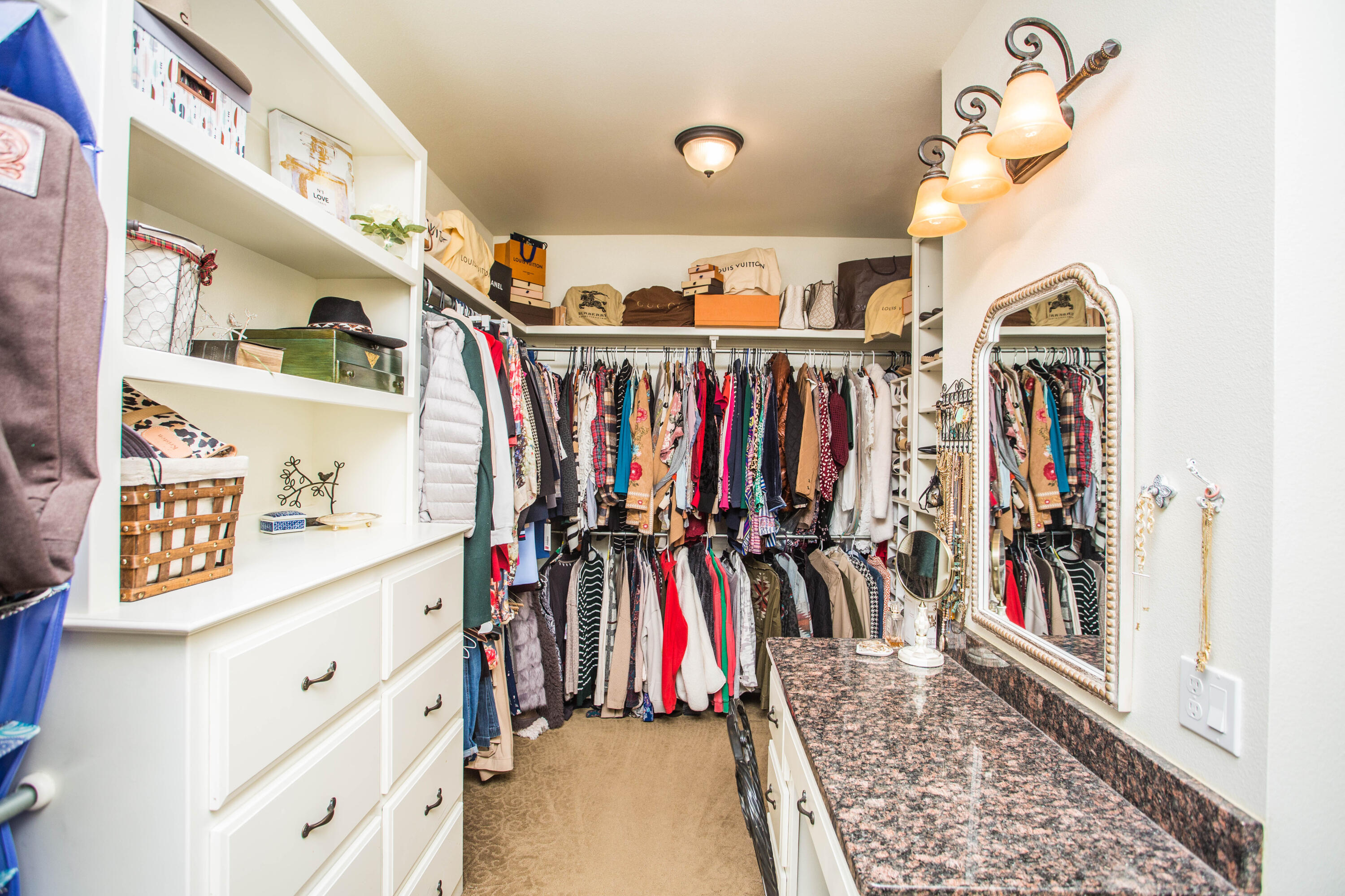 6018 87th Street Lubbock, TX 79424 - Photo 41 of 98 a view of walk in closet with clothes and shoes