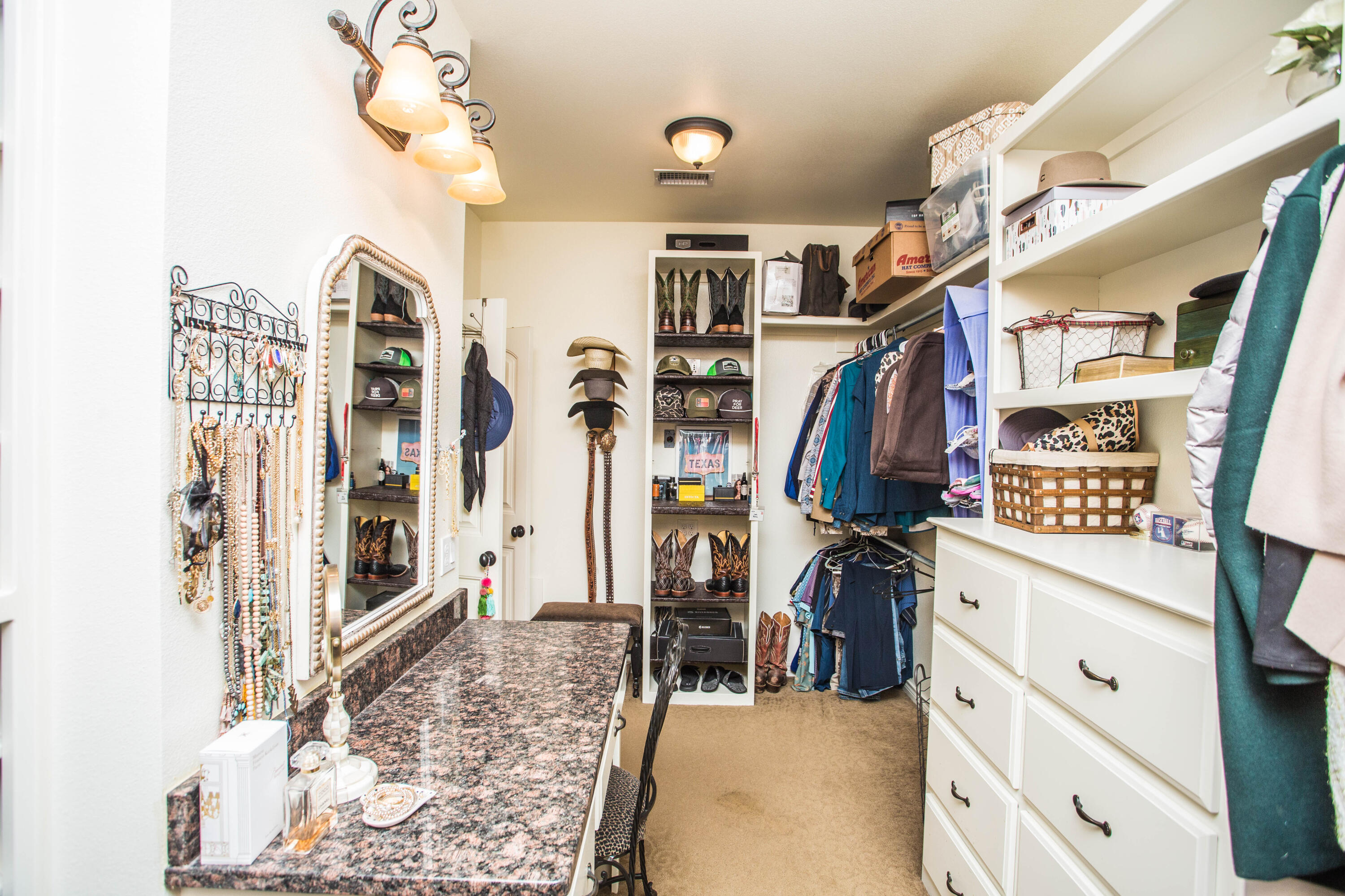 6018 87th Street Lubbock, TX 79424 - Photo 42 of 98 a view of walk in closet with clothes and shoes