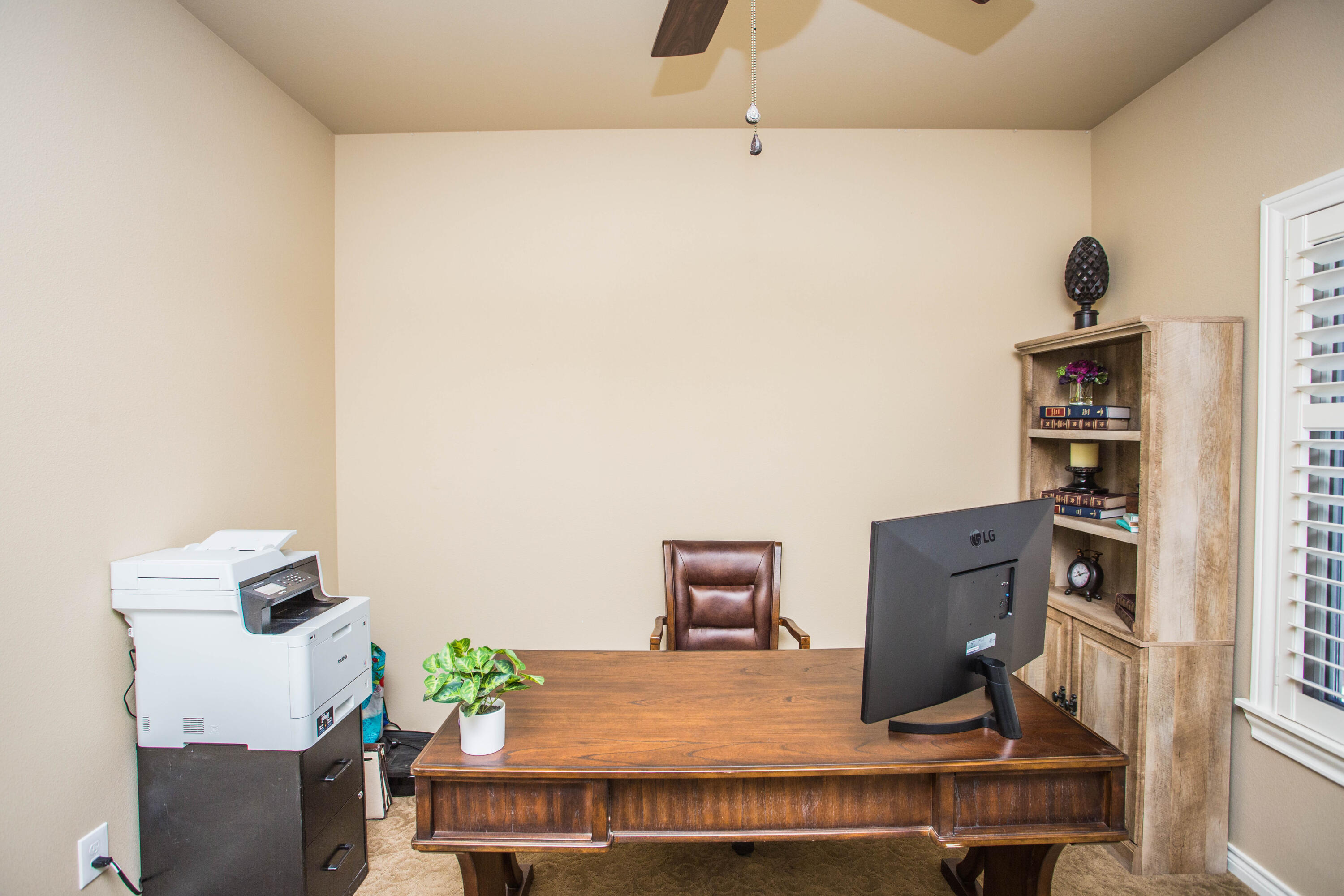 6018 87th Street Lubbock, TX 79424 - Photo 64 of 98 a living room with furniture and a table