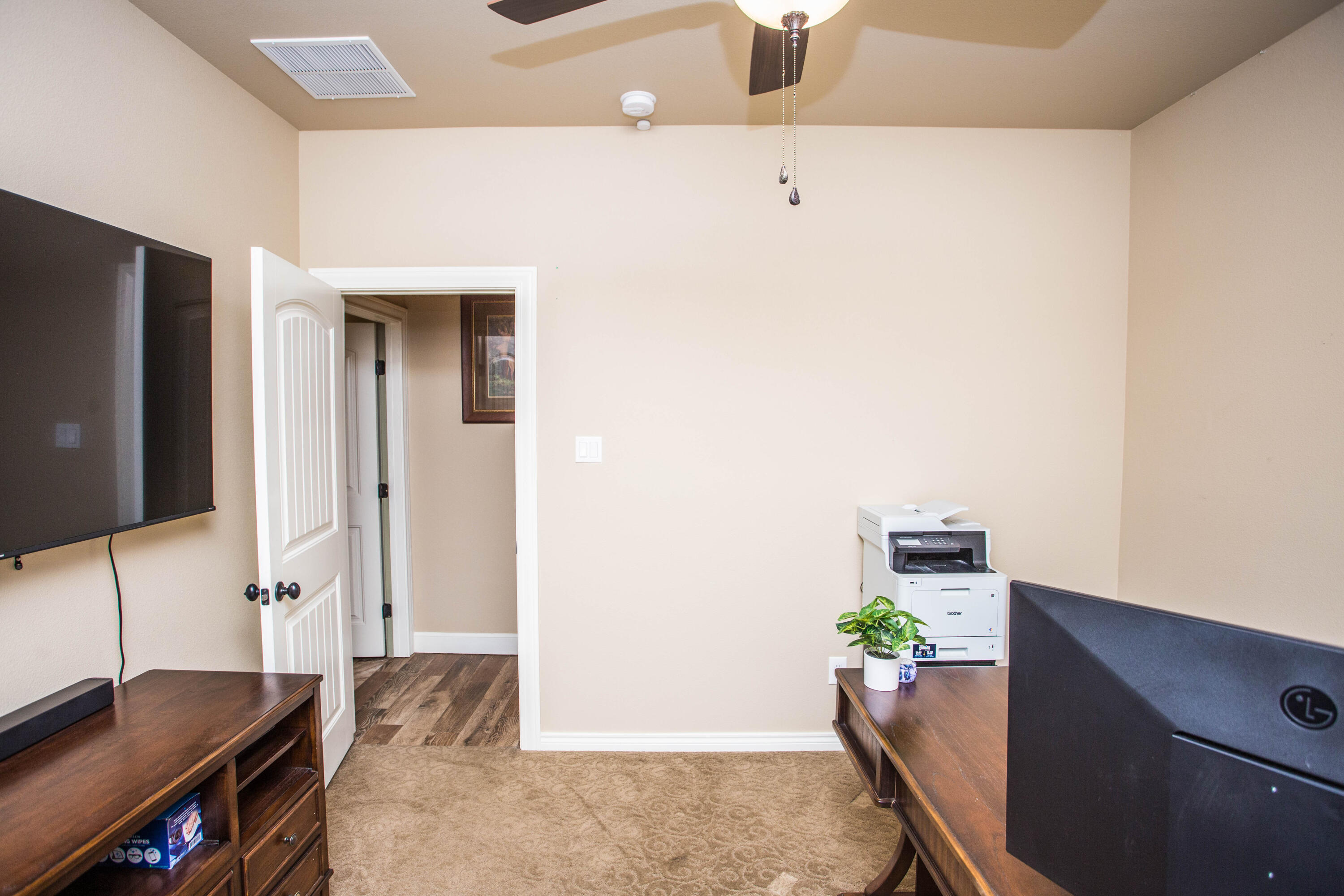 6018 87th Street Lubbock, TX 79424 - Photo 66 of 98 a workspace with furniture and mirror