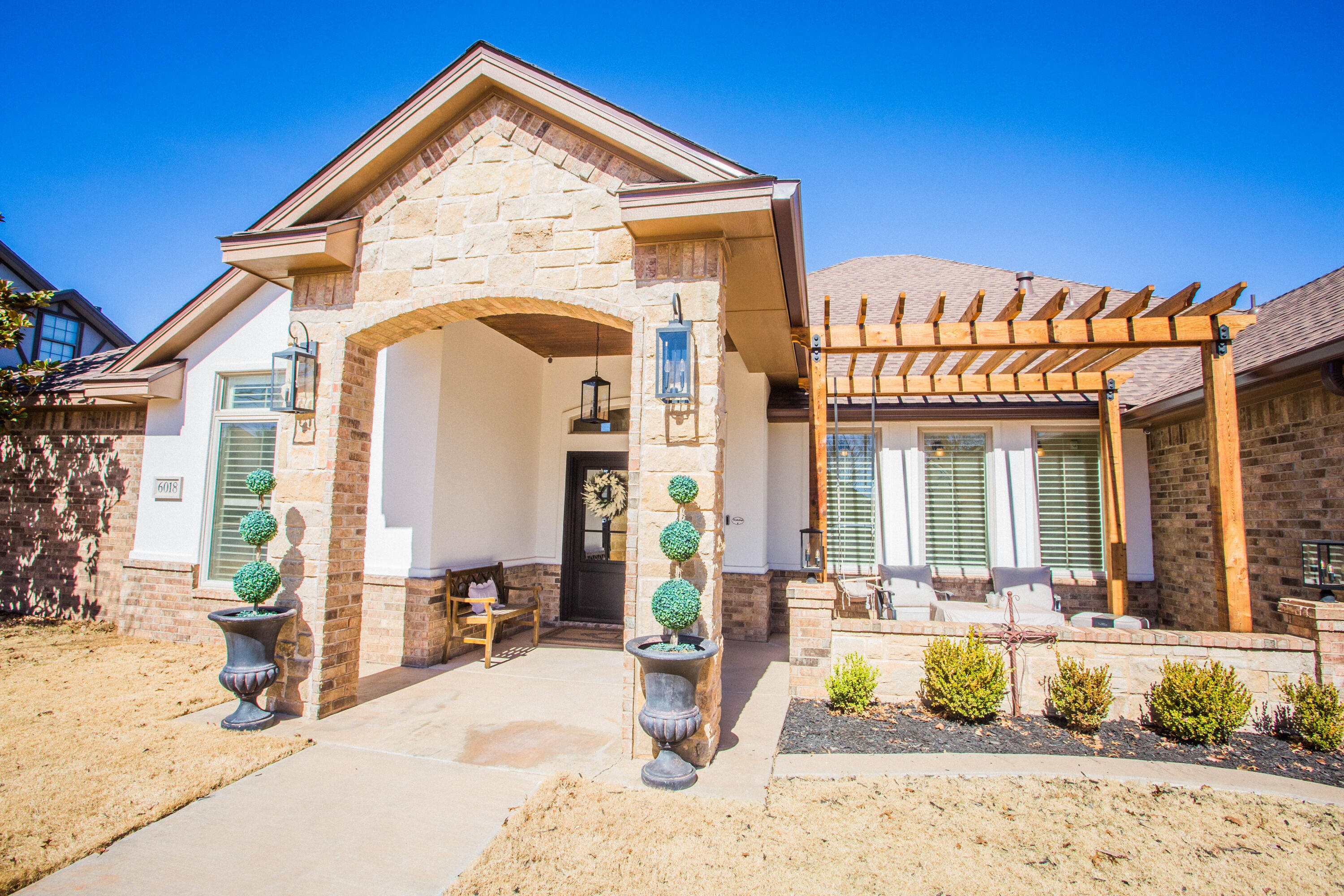 6018 87th Street Lubbock, TX 79424 - Photo 97 of 98 a view of a house with a swimming pool and sitting area