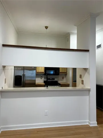 a view of microwave and sink